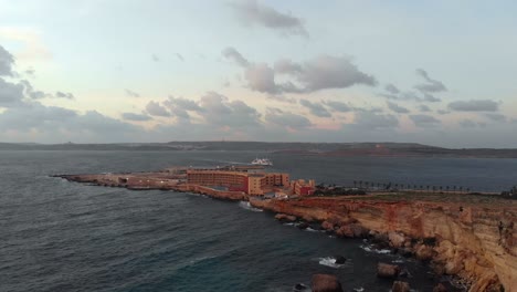 Aerial-drone-video-from-north-of-Malta,-Cirkewwa,-ferry-arrives-from-Gozo
