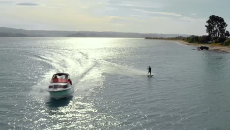 Water-skiier-crashes-in-shallow-water-of-Whakatane-river,-aerial