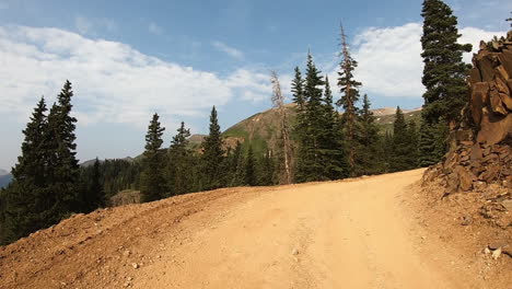 POV-while-driving-a-4WD-vehicle-along-trail-cut-in-mountain-side-above-Poughkeepsie-Gulch-near-Ouray-Colorado