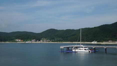 Ferry-Boat-On-A-Dock-Nearby-The-Beach-In-Geonje-City-South-Korea---wide-shot