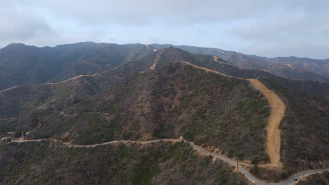 Aerial-View-Towards-Catalina-Island-Wrigleys-Road,-Mountain-Trails-on-a-Cloudy-Morning
