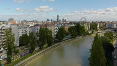 Aerial-Establishing-Shot-Along-Danube-Canal-in-Vienna,-Austria