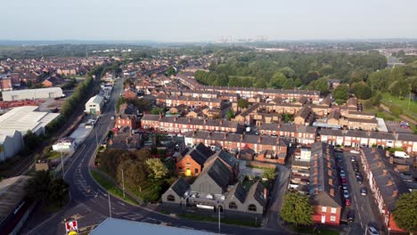 Warrington-town-centre-outskirts-aerial-view-above-industrial-canal-suburban-roads-and-houses-skyline