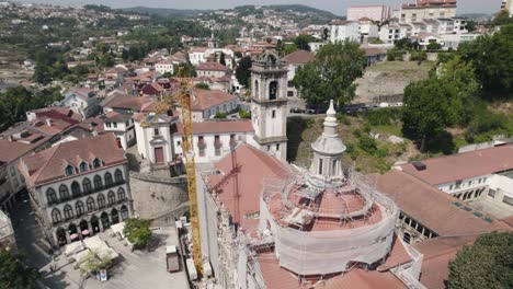 Aerial-close-up-shot-of-monastery-of-Sao-Goncalo-under-restore,-repair-maintenance