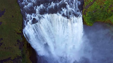 Powerful-Skogafoss-Waterfall-In-Skogar,-South-Iceland---aerial-drone-shot