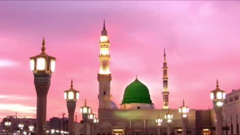 Mid-shot-front-view-of-the-Mosque-with-lights-after-sundown-with-a-colorful-sky-at-sunset
