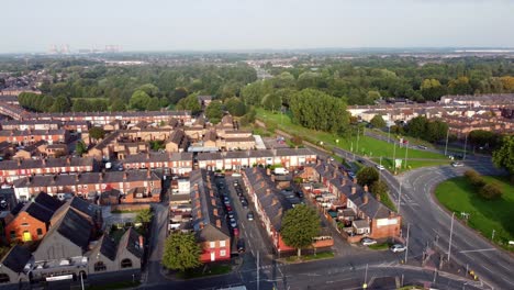 Warrington-town-centre-outskirts-aerial-view-above-industrial-residential-roads-and-houses-skyline-right-pan