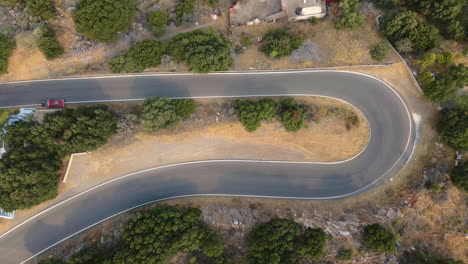 Aerial-View-Of-A-Hairpin-Turn-In-A-Road-In-Crete-Island,-Greece---Hairpin-Corner