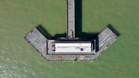 Aerial-Rising-Looking-Down-Over-End-Of-Deal-Pier-In-Kent