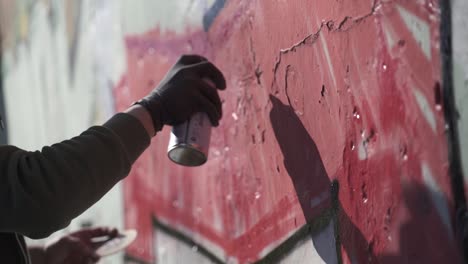Writers-painting-graffiti-on-wall.-Slow-motion