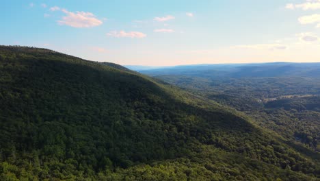 Beautiful-aerial-drone-video-footage-of-late-summer-and-early-fall-in-an-Appalachian-Mountain-valley-with-forests-and-rolling-green-hills