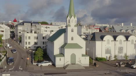 Magical-golden-hour-sunlight-shines-on-historic-Frikirkjan-church-in-Iceland