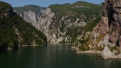 Ferry-journey-on-beautiful-lake-across-rocky-mountains-in-Northern-Albania