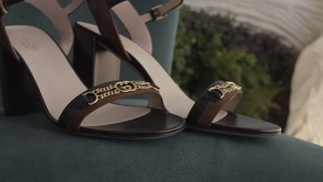 Gucci-shoes-on-wedding-day,-decoration-outdoor-hotel-in-morning-background