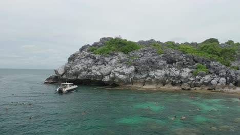 Tourist-snorkeling-in-tropical-water-at-Koh-Wao-island-in-Ang-Thong-marine-park