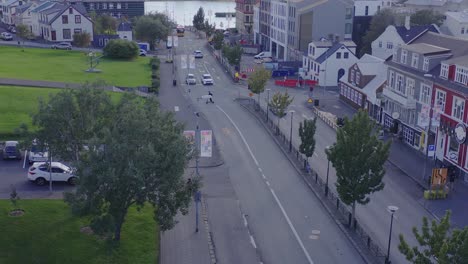 Aerial-at-calm-Lækjargata-street-in-district-Midborg-during-sunset,-Reykjavik