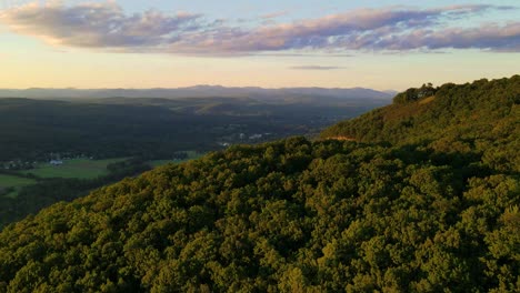 Beautiful-aerial-drone-time-lapse-footage-of-late-summer-and-early-fall-in-an-Appalachian-Mountain-valley-with-forests-and-rolling-green-hills