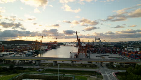 Gdynia-Harbor,-silhouette-of-cranes-during-sunset,-aerial