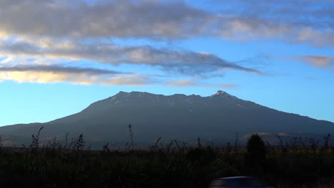 Clouds-moving-past-Mount-Ruapehu-with-afternoon-sunlight,-timelapse