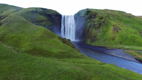 Beautiful-Scenery-Of-The-Majestic-Skogafoss-Waterfall-In-Countryside-Of-Iceland-In-Summer---aerial-drone-shot