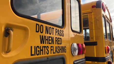 Do-Not-Pass-When-Red-Lights-Flashing-caution-warning-on-back-of-school-bus