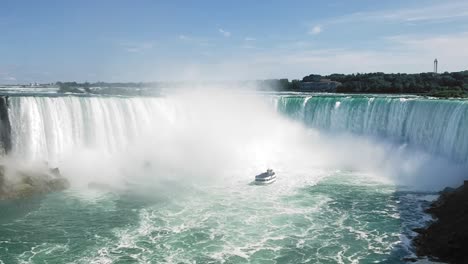 Stunning-wide-angle-of-the-Maid-of-the-Mist-approaching-the-base-of-Niagara-Falls