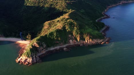 Aerial-drone-rotating-over-lush-tropical-Lantau-island