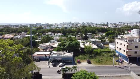 santiago,-dominican-republic---drone-flight-through-the-streets-of-santiago-de-los-caballeros,-commercial-area