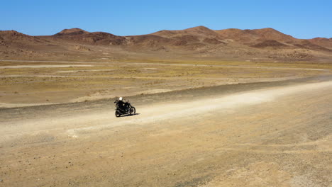 Motorcycle-road-trip-in-the-desert-during-a-hot-sunny-clear-day