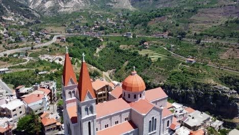 Drone-Flight-Over-Saint-Saba-Cathedral-In-Bsharri,-Lebanon-With-Picturesque-View-Of-Kadisha-Valley