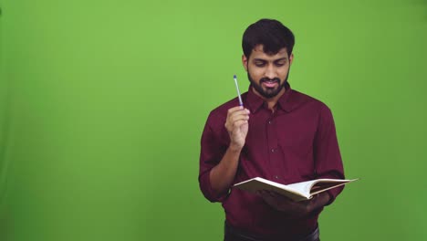 Attractive-man-reading,-thinking-and-getting-new-idea,-isolated-on-green-screen