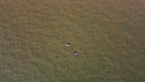 Aerial-View-Of-Two-Paddle-Boarders-On-North-Sea-Off-Deal-Coastline