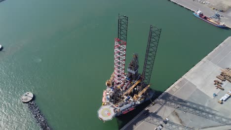 North-sea-Oil-rig-platform-at-Great-Yarmouth-,Norfolk-UK-Overhead-aerial-4K-footage-Point-of-view