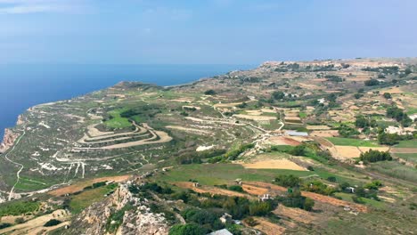 Gorgeous-aerial-drone-video-from-west-of-Malta,-Dingli-area,-flying-over-the-steep-hills-on-a-sunny-day