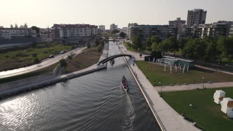 Cityscape-of-Aveiro-with-water-canal-and-many-bridges,-aerial-drone-view