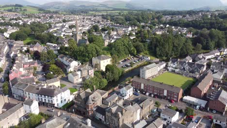 Cockermouth-town-high-street,-Lake-District-Cumbria-UK-pull-back-drone-reveal-aerial-footage-4K