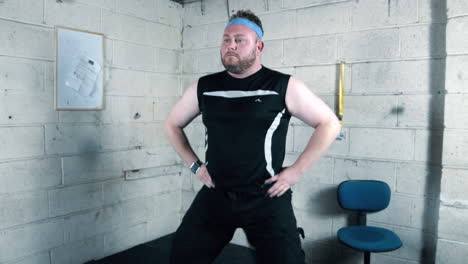Funny-overweight-man-doing-hip-workout-exersises-in-a-garage
