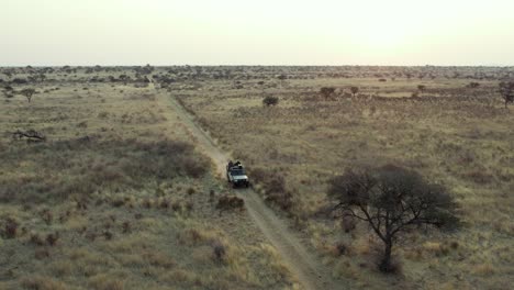 People-on-off-road-car-driving-along-safari-trails-in-Namibia,-Africa