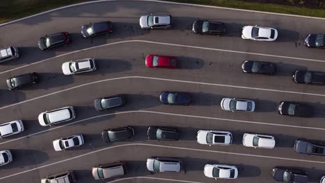 Multiple-lanes-of-cars-and-vehicles-in-bumper-to-bumper-line-revealed-in-top-down-drone-shot
