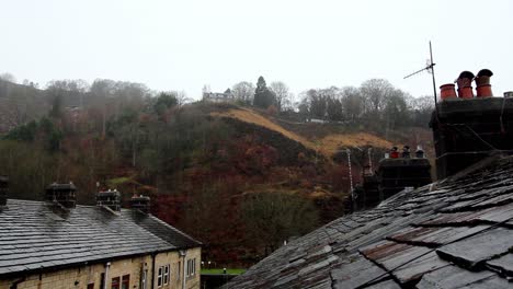 early-snow-falling-in-northwest-yorkshire-,-on-old-terraced-house-roofs