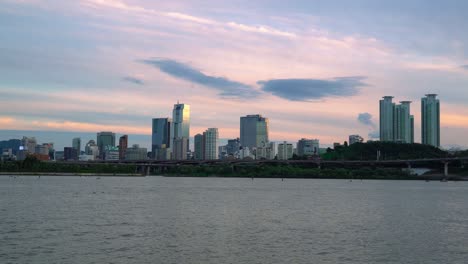 Waterfront-Cityscape-With-Towers-And-High-Rise-Buildings-In-Han-River,-Seoul,-South-Korea