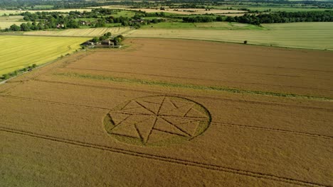 Paranormal-farmland-crop-circle-geometry-artwork-Stanton-St-Bernard-aerial-view-Wiltshire-pull-back