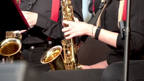 Saxophonists-In-An-Orchestra-Performing-Music-On-Stage-During-Concert