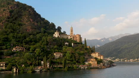 Rotating-drone-shot-of-Chiesa-di-Santa-Maria-del-Sasso-in-Switzerland-flying-over-Lugano-lake