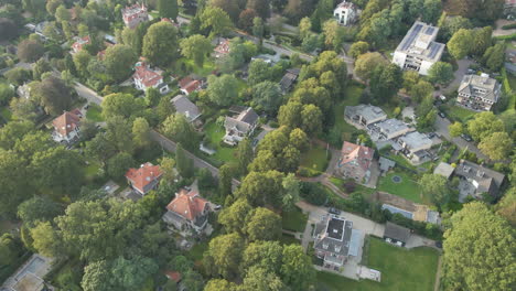 Aerial-of-wealthy-suburban-neighborhood-with-villas-and-mansions