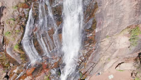 Drone-aerial-shot-approaching-a-tropical-waterfall-In-Brazil-from-above