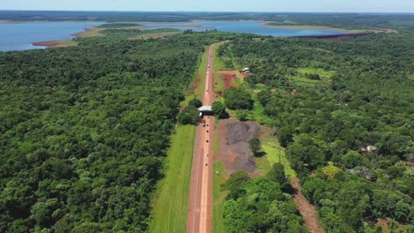 Incredible-exotic-road-crossing-a-jungle-and-a-large-lake-in-Misiones,-Argentina