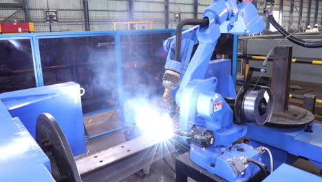 Robotic-Welding-Machine-Assembling-Metal-With-Roll-Of-Welding-Wire-Attached