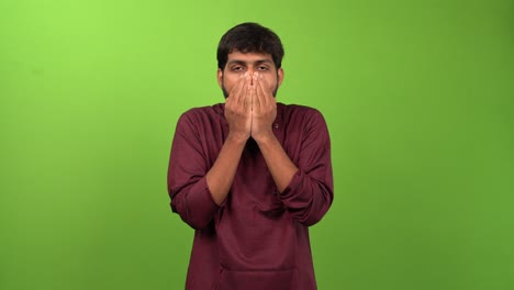 Young-attractive-man-feeling-amazement-while-looking-at-camera,-isolated-on-green-screen
