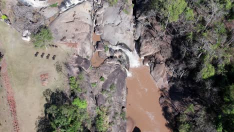 Aerial-view-of-a-cascading-waterfall-and-its-adjoining-areas